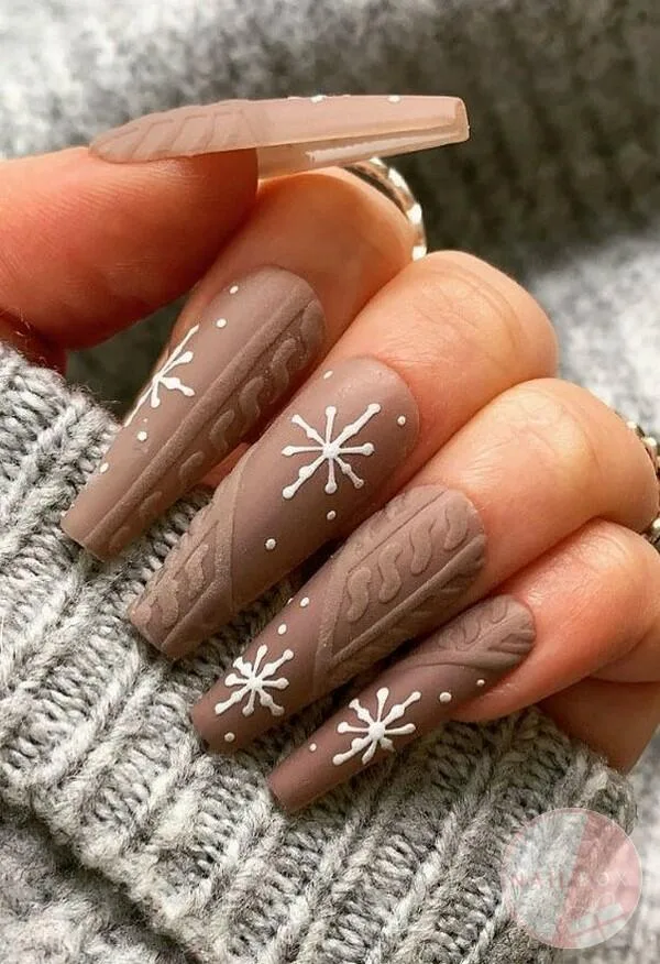 Create a winter wonderland on your nails with snowflake designs.